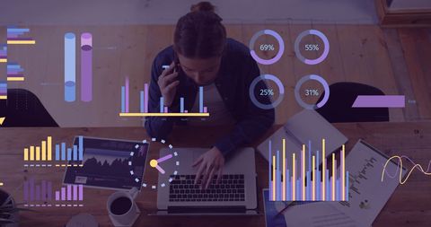 Businesswoman Analyzing Data on Laptop with Financial Graphs