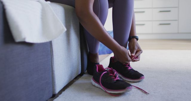 Preparing for Exercise by Tying Running Shoes - Download Free Stock Images Pikwizard.com