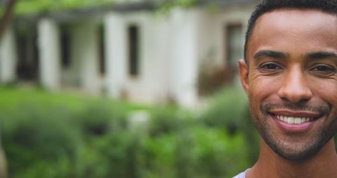 Close-up of Smiling Man Outdoors Near Home Garden