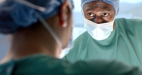 Surgeons Collaborating During Surgery with Focused Communication - Download Free Stock Images Pikwizard.com