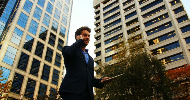 Young Professional Managing Business Calls in Urban Area - Download Free Stock Images Pikwizard.com