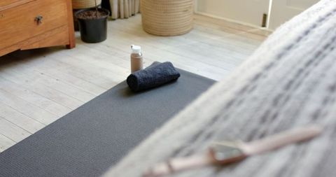 Home gym setup with yoga mat for wellness and fitness