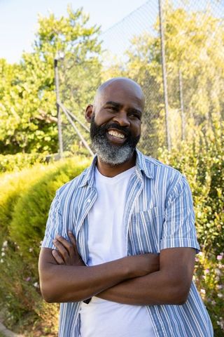 African American Man Smiling Confidently Outdoors