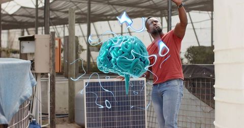 Innovative technician interacting with futuristic brain hologram