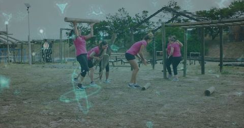 Women Building Strength and Teamwork in Outdoor Obstacle Course
