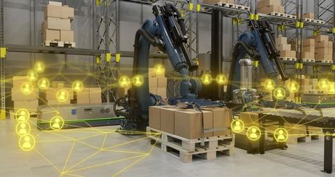 Robotic arms loading cartons on pallets in automated warehouse with ai network overlay