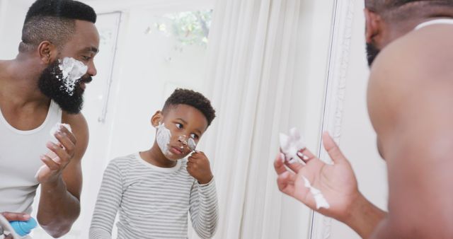 Father and Son Shaving Together in Bathroom Mirror - Download Free Stock Images Pikwizard.com