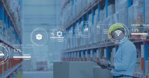 Industrial supervisor analyzing digital data in high-tech warehouse