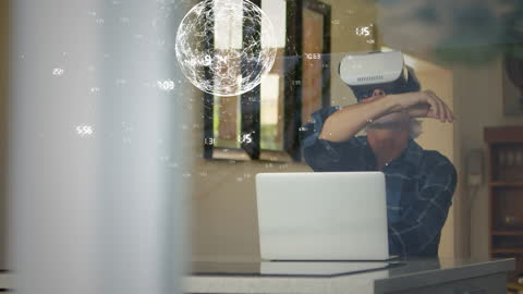 Senior Man Explores Virtual World with VR Headset at Home