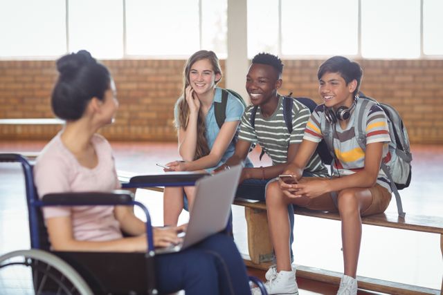 Diverse Group of Students Engaging with Disabled Classmate - Download Free Stock Photos Pikwizard.com