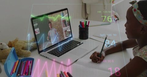 Child engaging in remote learning with augmented reality biometric overlay on laptop