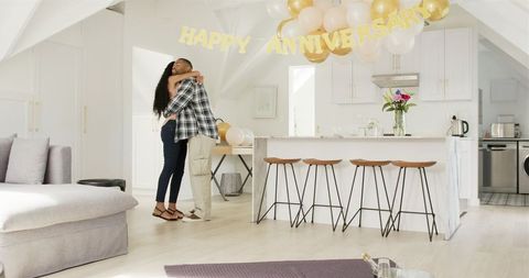 Couple Celebrating Anniversary with Love and Joy at Home