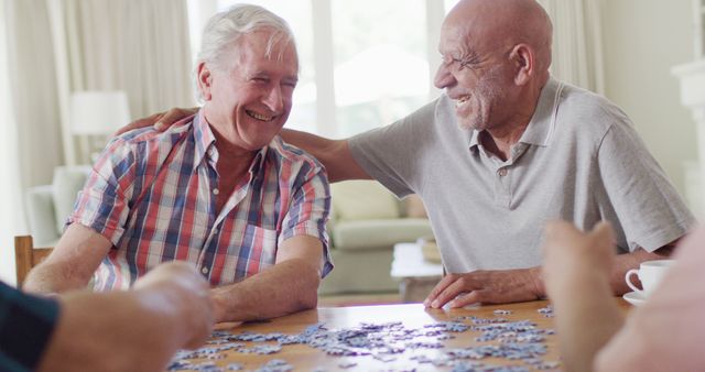 Senior Friends Enjoying Jigsaw Puzzle Together at Home - Download Free Stock Images Pikwizard.com