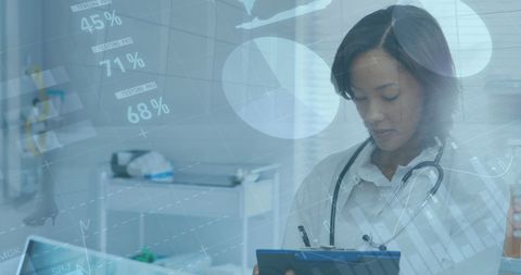 Diverse Female Doctor Using Infographic Data in Modern Hospital - Download Free Stock Images Pikwizard.com