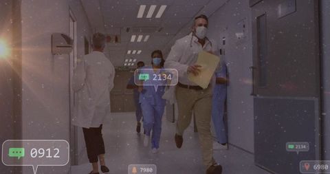 Doctor urgently responding to hospital alert in corridor