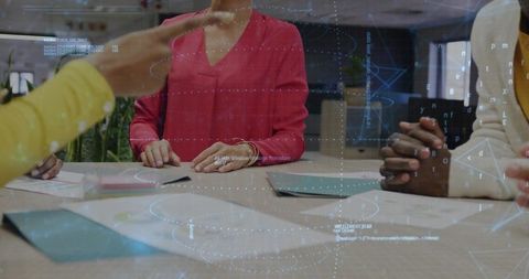 Diverse Team Collaborating with Data Projections