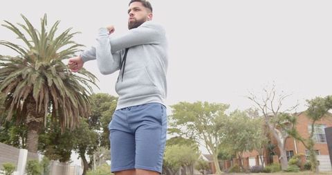 Man Stretching Outdoors in Urban Suburban Area