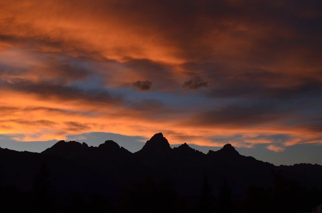 Sunset Over Mountain Range with Dramatic Clouds - Download Free Stock Photos Pikwizard.com