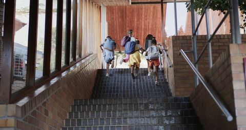 Diverse School Children Ascending Stairs in Educational Setting - Download Free Stock Images Pikwizard.com
