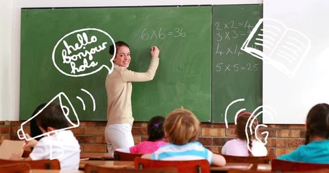 Female Teacher Engaging Students with Chalkboard Lessons