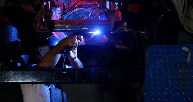 Automotive Mechanic Welding Car Undercarriage in Workshop - Download Free Stock Images Pikwizard.com