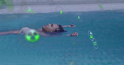 Woman floating in pool with augmented reality environmental icons, futuristic wellness