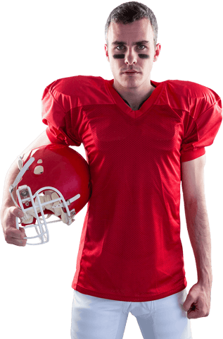 Focused american football player holding helmet on transparent background