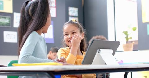 Smiling Students Engaged with Tablet Technology in Classroom - Download Free Stock Images Pikwizard.com