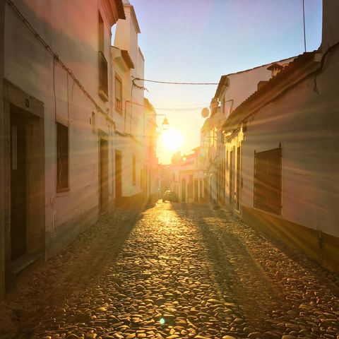 Sunset glow on rustic cobblestone street