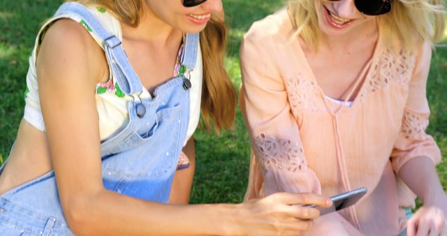 Friends Enjoying Outdoor Time Looking at Smartphone - Download Free Stock Images Pikwizard.com