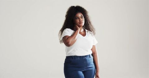 Confident African American Woman in Minimalist Fashion Pose
