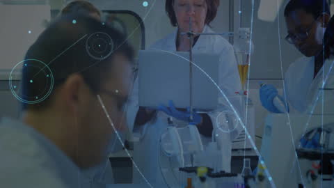 Innovative Team of Scientists Analyzing Digital Data in Laboratory