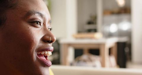 Smiling african american woman in warm home setting