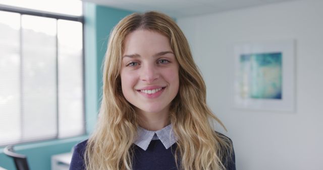 Smiling Businesswoman with Long Blond Hair in Bright Office - Download Free Stock Images Pikwizard.com