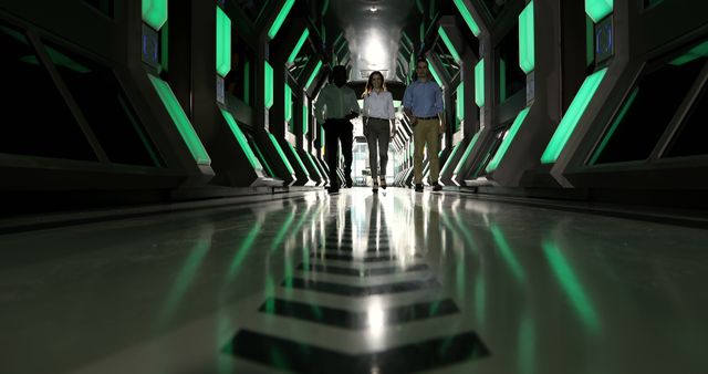 Group of Professionals Walking in Futuristic Green-Lit Corridor - Download Free Stock Images Pikwizard.com