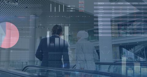 Businesspeople discussing economic data on escalator