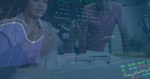 Business Colleagues Analyzing Market Data on Screen at Office