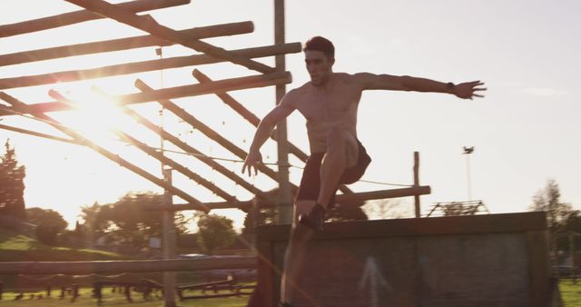 Man Training on Outdoor Obstacle Course at Sunset - Download Free Stock Images Pikwizard.com