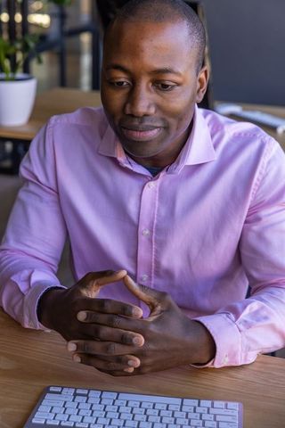 Business Professional Focused at Work Desk in Modern Office