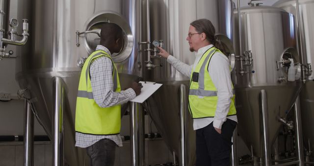 Workers Inspecting Industrial Machinery in Brewery - Download Free Stock Images Pikwizard.com