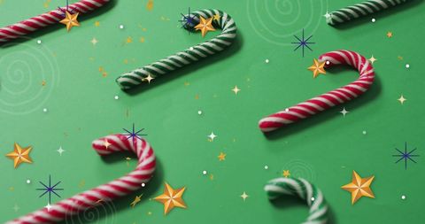 Festive Candy Canes on Green Background with Stars