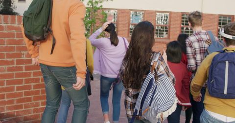 Diverse Students Leaving School Together with Backpacks - Download Free Stock Images Pikwizard.com