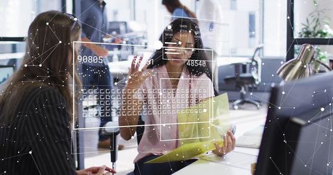 Diverse Business Team Collaborating with Financial Data in Office