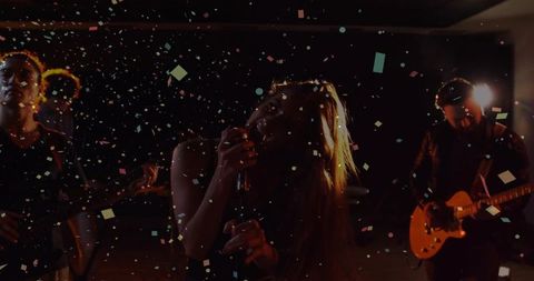 Live Band Performance with Vibrant Confetti and Passionate Vocals