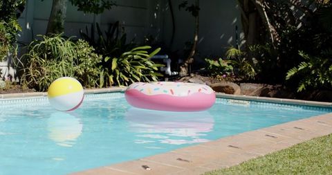 Doughnut Inflatable in Luxe Pool with Bright Beach Ball Experience