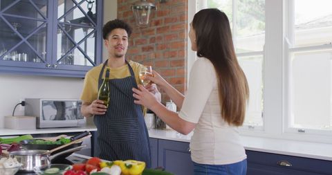 Couple Enjoys Cooking and Wine in Modern Kitchen - Download Free Stock Images Pikwizard.com