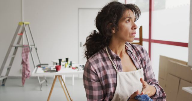 Female Artist Daydreaming in Studio - Download Free Stock Images Pikwizard.com