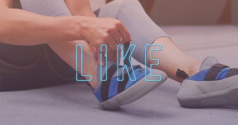 Woman tying sport shoe laces with social media concept