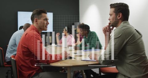 Team Collaborating with Overlay of Financial Data in Modern Office