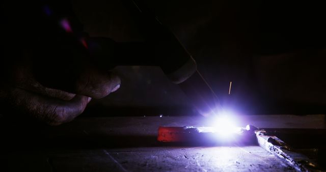 Close-up of Hand Using Welding Equipment with Intense Spark - Download Free Stock Images Pikwizard.com